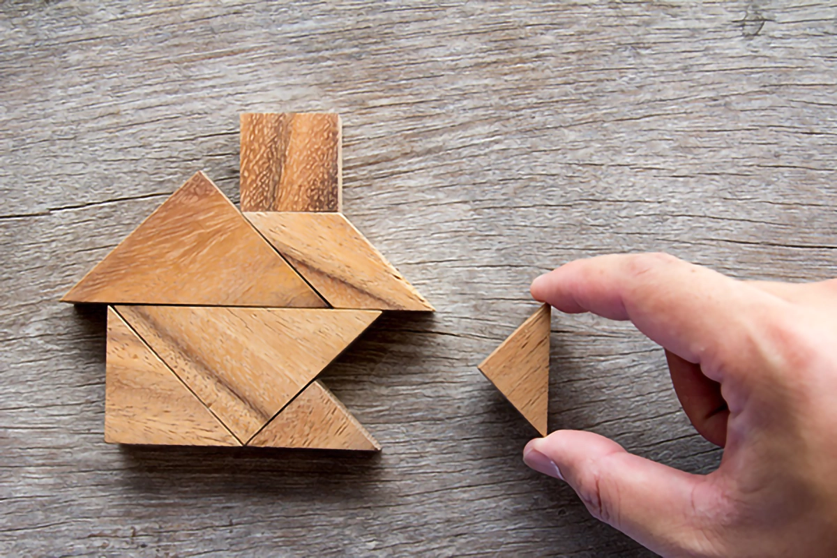 Image of wooden shape blocks forming the shape of a house