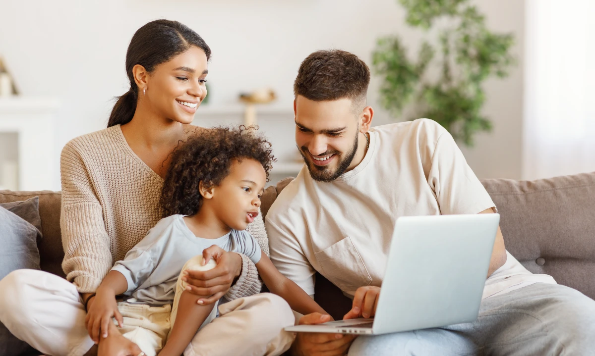 A family using a laptop